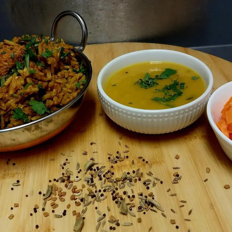 Chicken breyani served with dhall and carrot salad