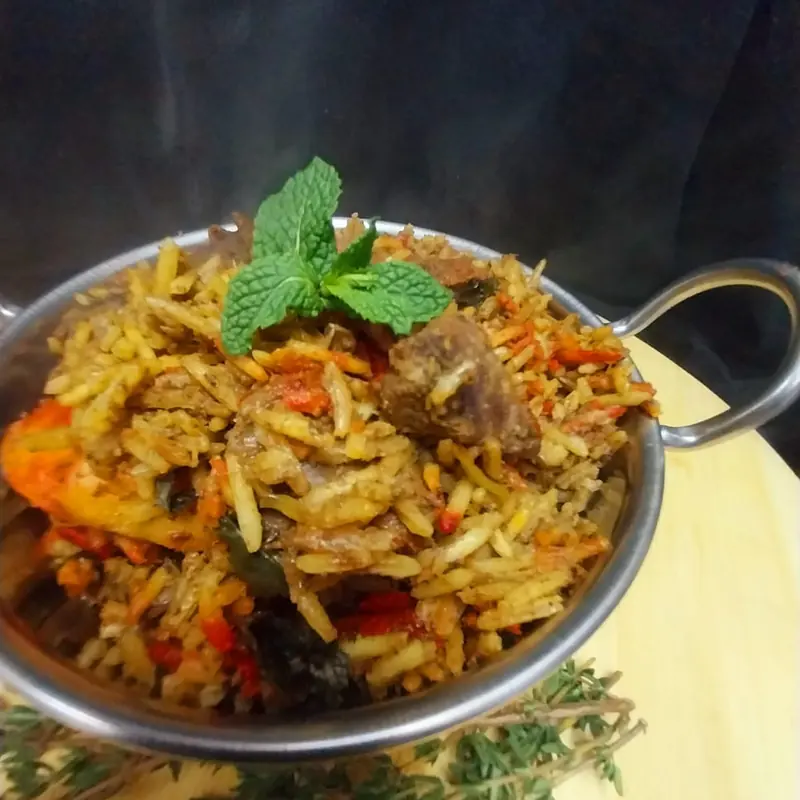 Lamb breyani topped with fresh mint